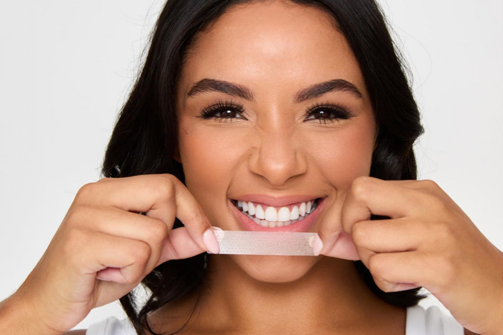 A lady using the Icy Bear teeth whitening Gel and Brightening Kit